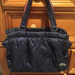 Lacoste 3 compartment purse. Like new.